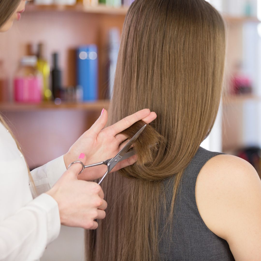 Stylist cutting long hair